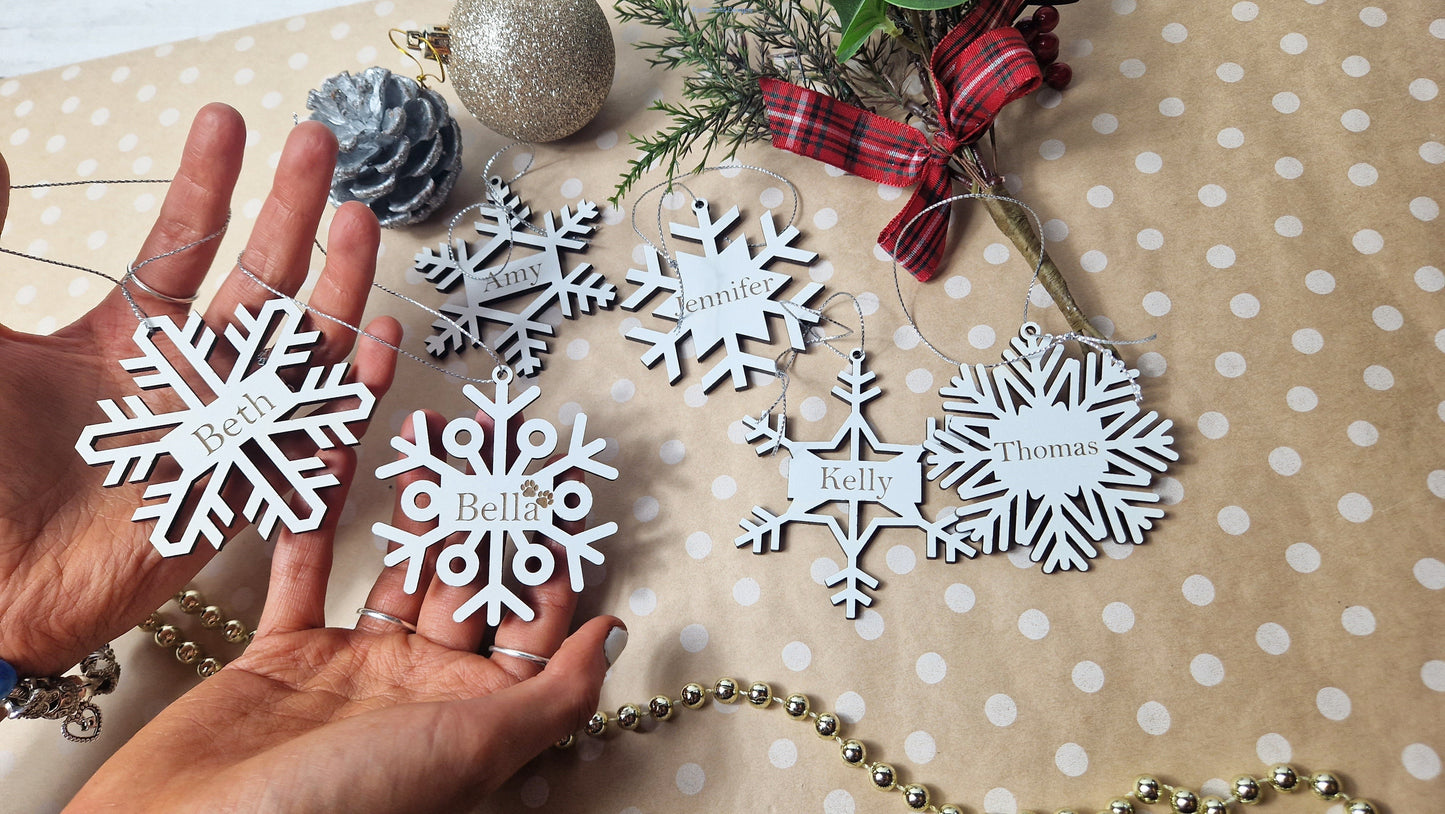 Personalised wooden snowflake tree baubles or gift bag tags.
