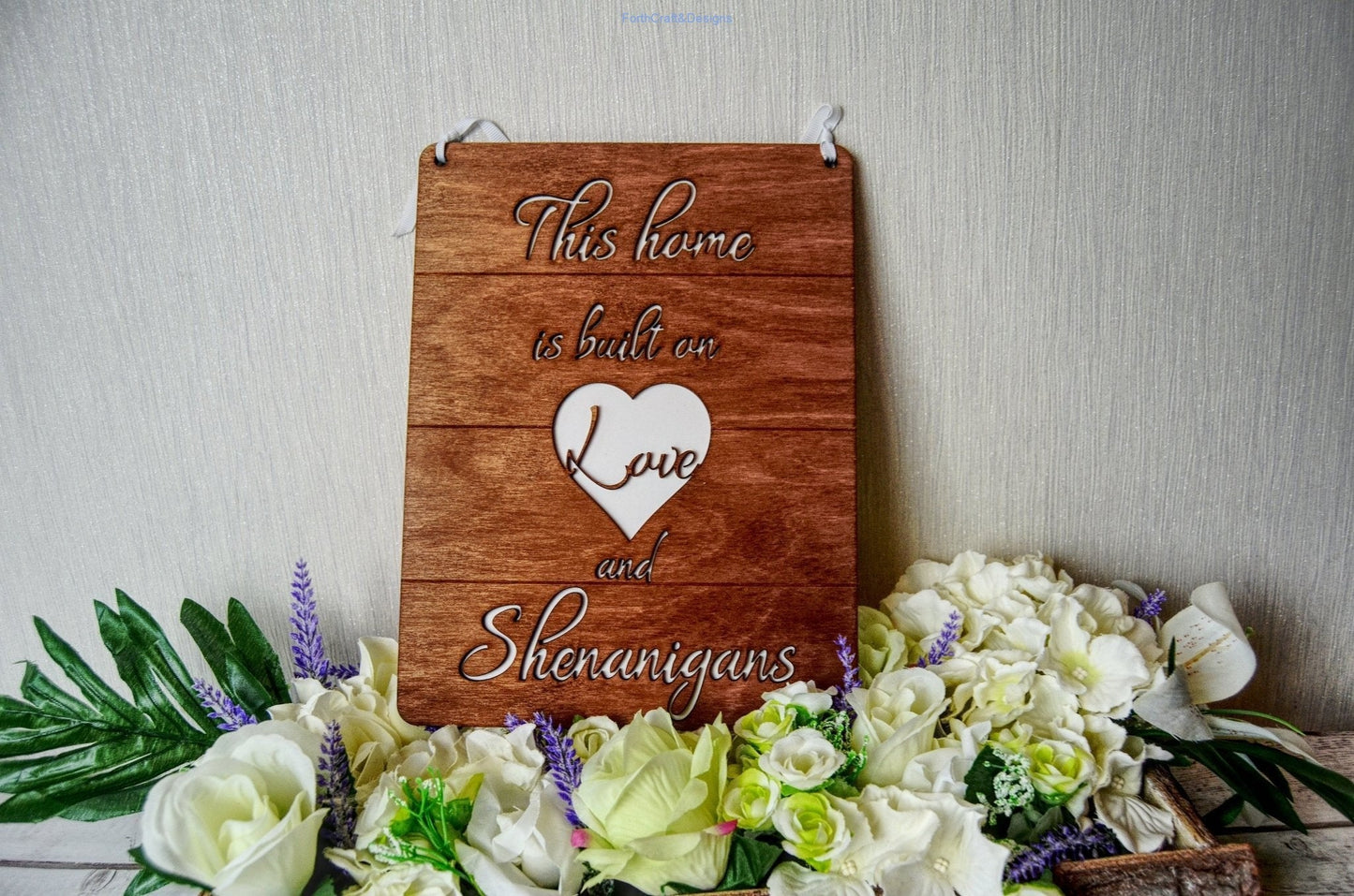 Wooden this home is built on love and shenanigans sign