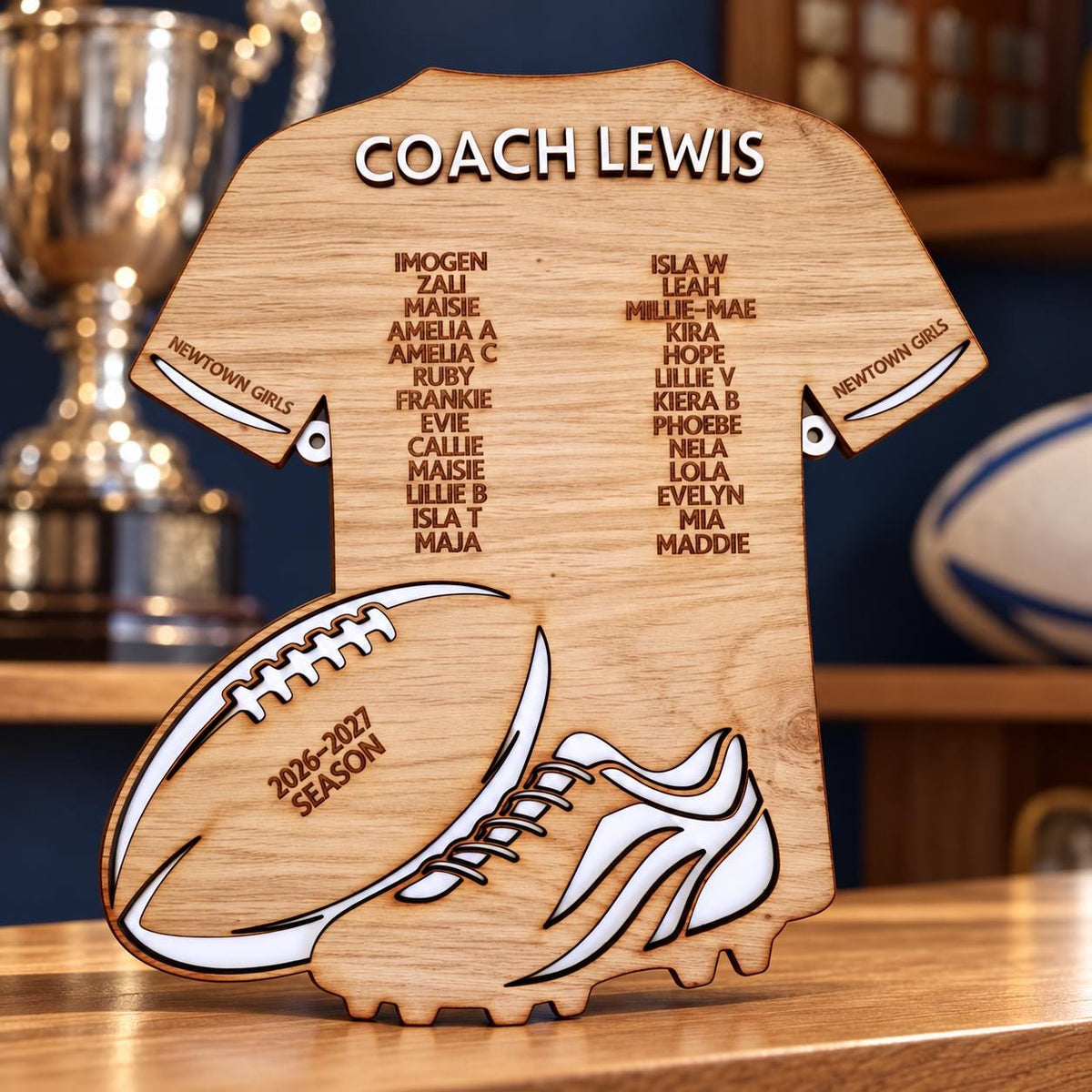 Personalised wooden rugby coach gift plaque with coach and player names on a rugby shirt design, featuring rugby ball and boot details.