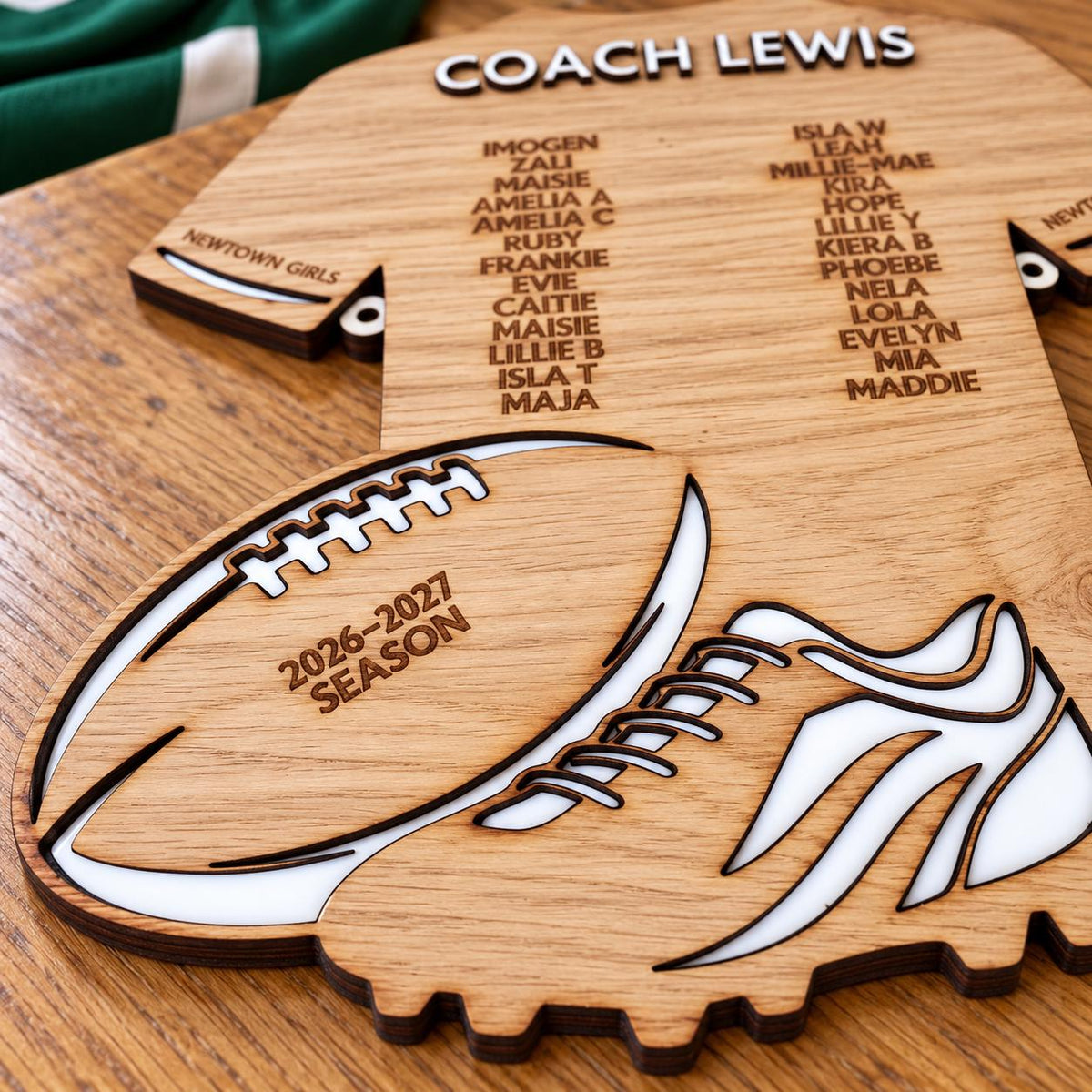 Personalised wooden rugby coach gift plaque with coach and player names on a rugby shirt design, featuring rugby ball and boot details.